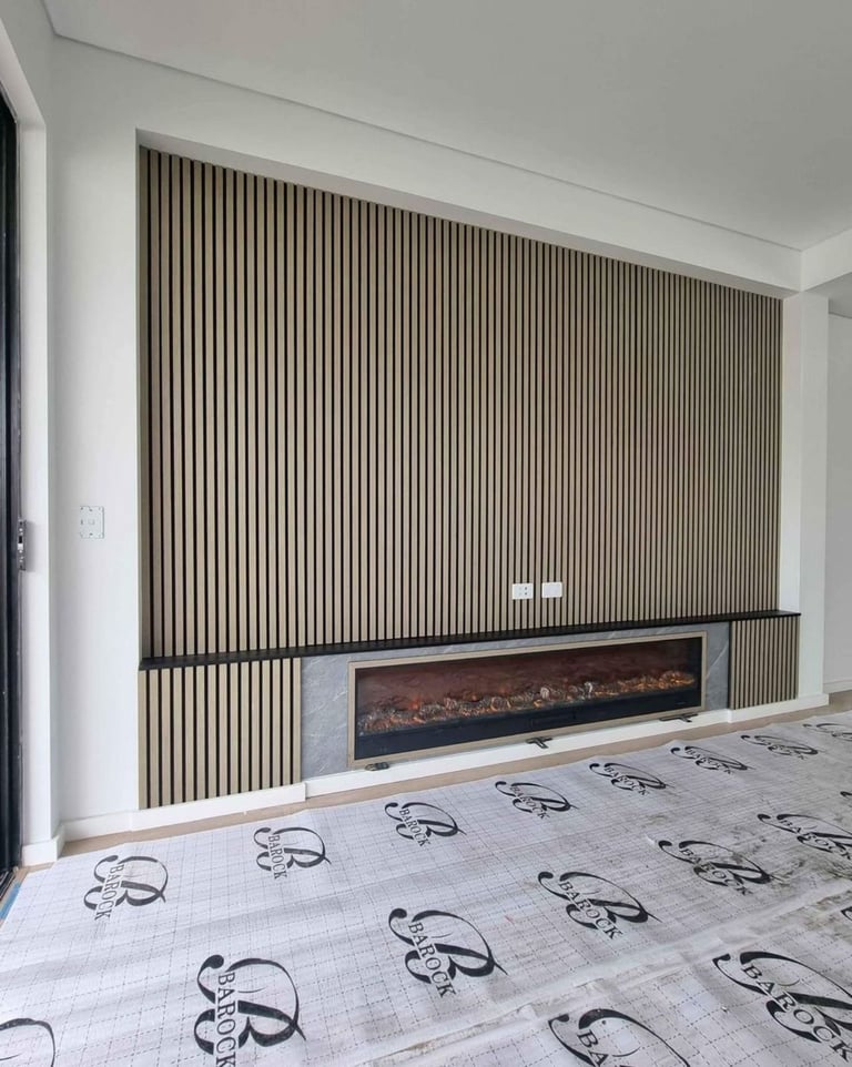 Modern bedroom with vertical wood slat wall feature, built-in fireplace, and patterned flooring during construction or renovation